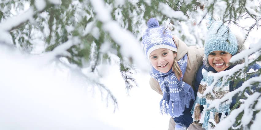 child making snow angels